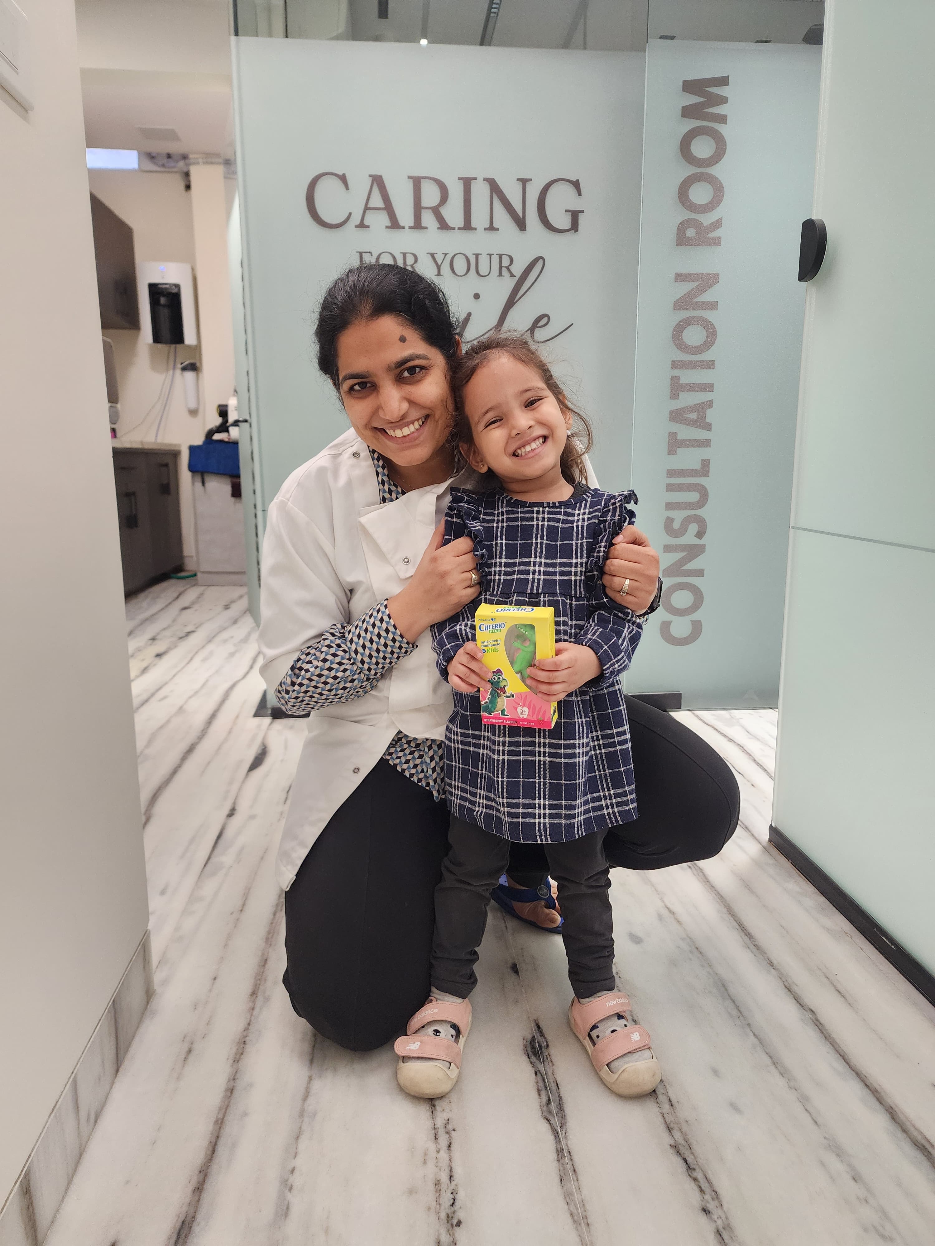 Dr. Harmeet Passi Bhardwaj with a young patient